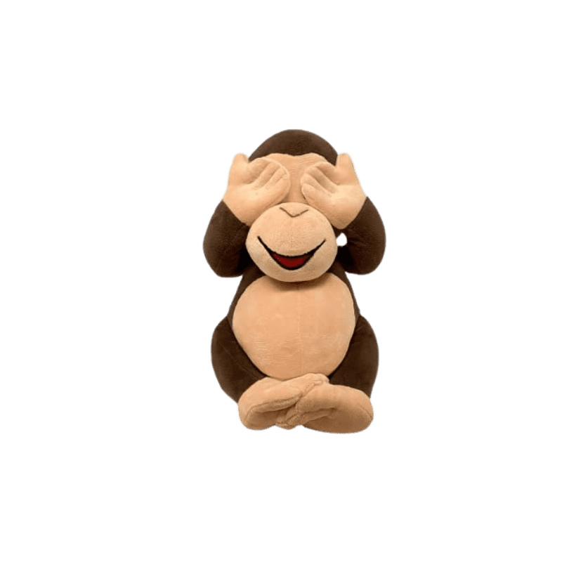 A stuffed monkey with its hands in front of his face.