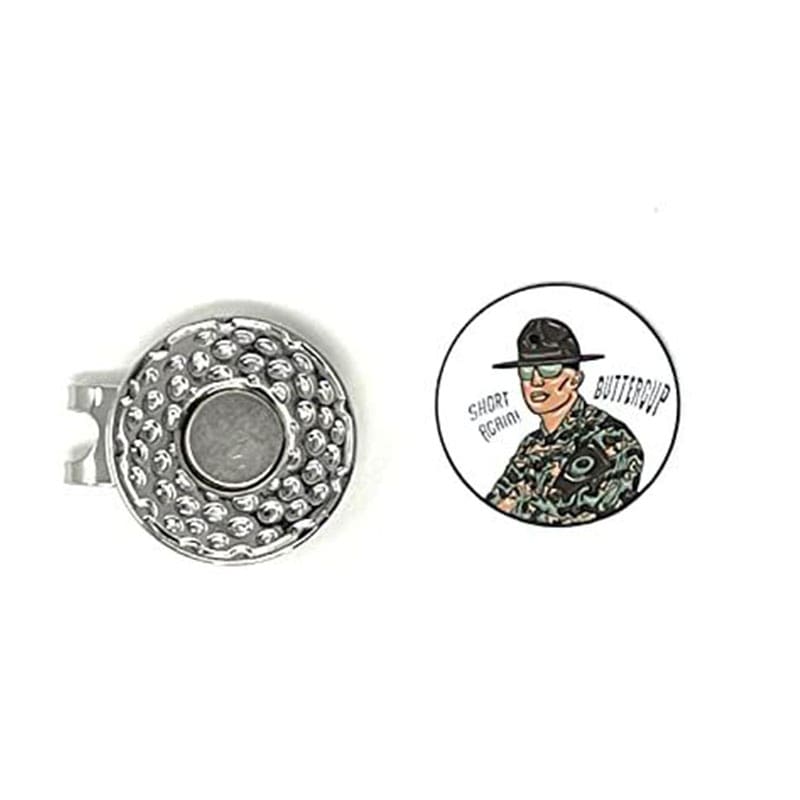 A silver pin with a soldier in camouflage and another pin with a man wearing a hat.