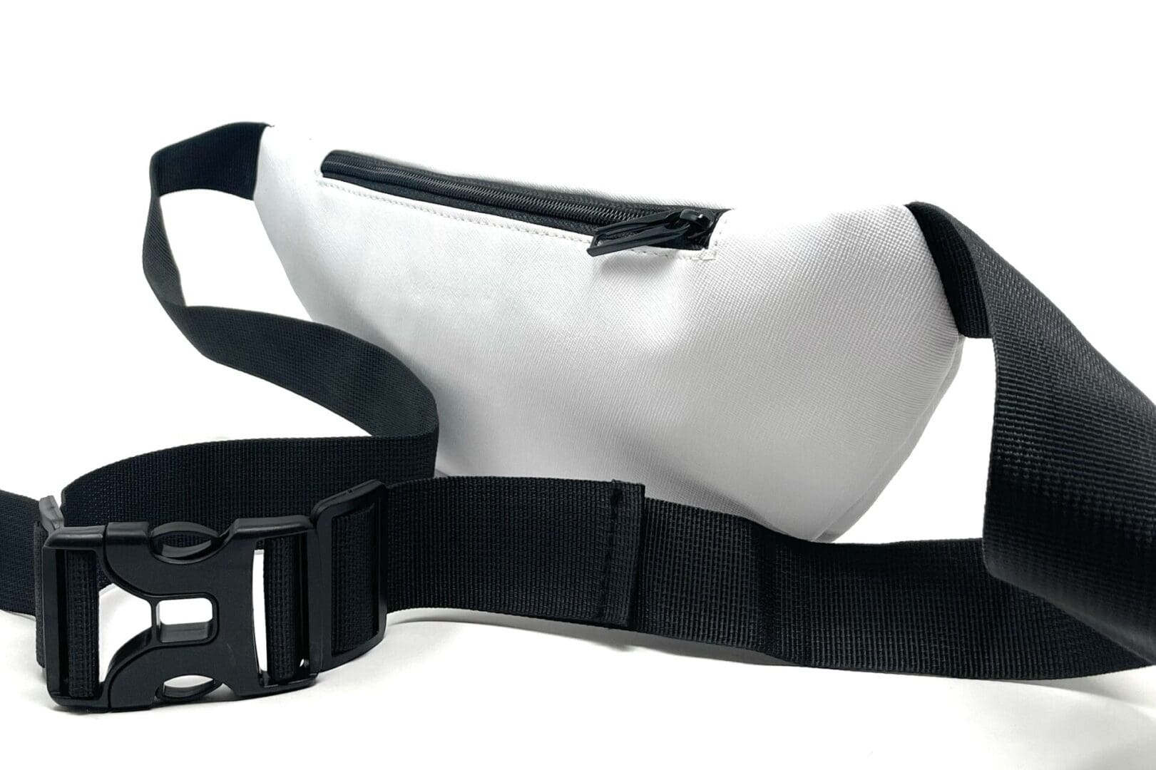 White fanny pack with black strap.