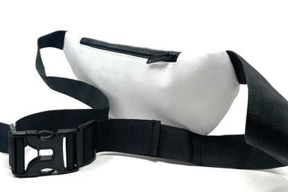 White fanny pack with black strap.