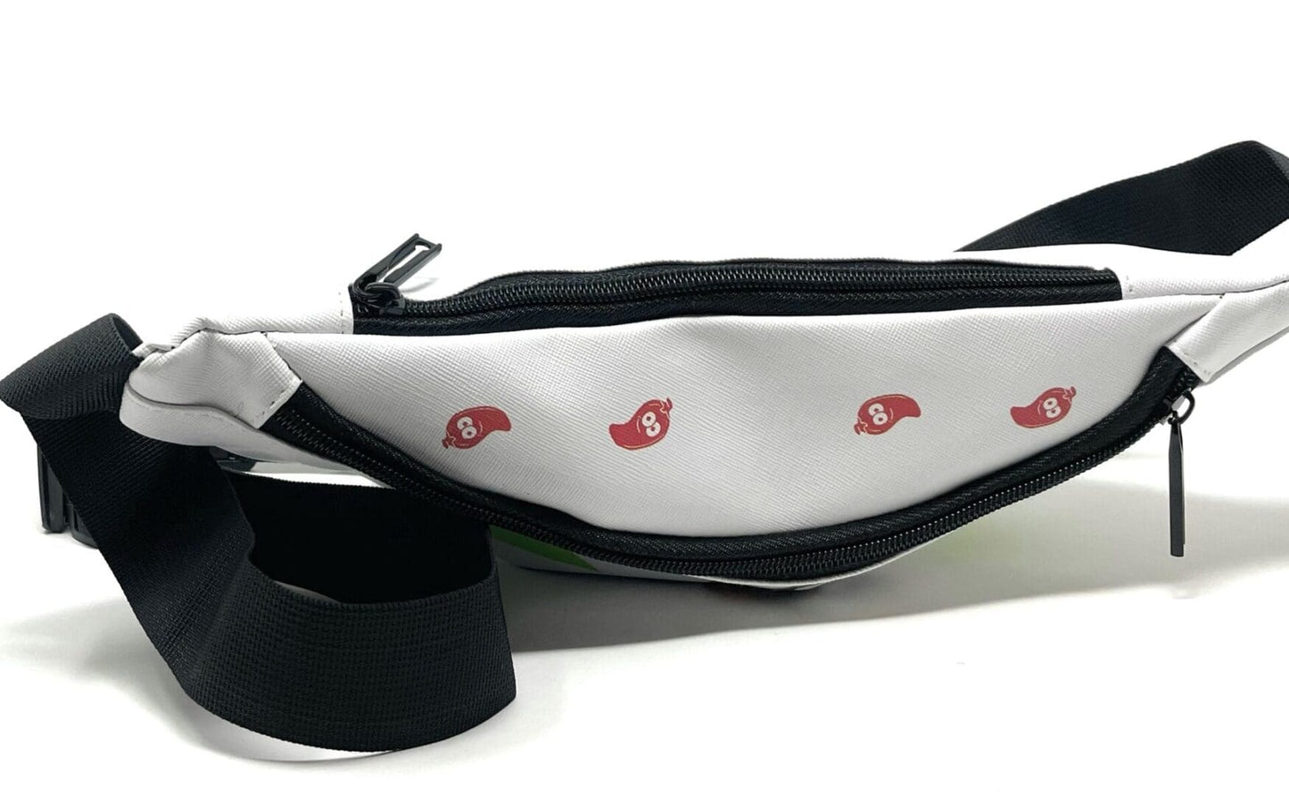 White fanny pack with red peppers.