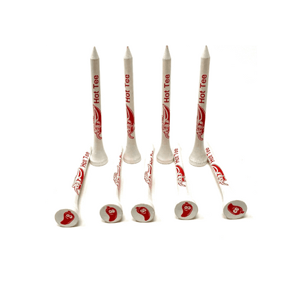 Six white golf tees with red peppers.
