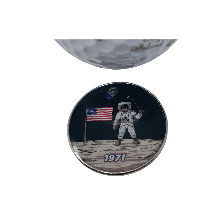 Astronaut on moon with American flag and golf club.