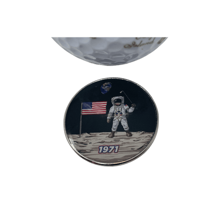 Astronaut on moon with American flag and golf club.