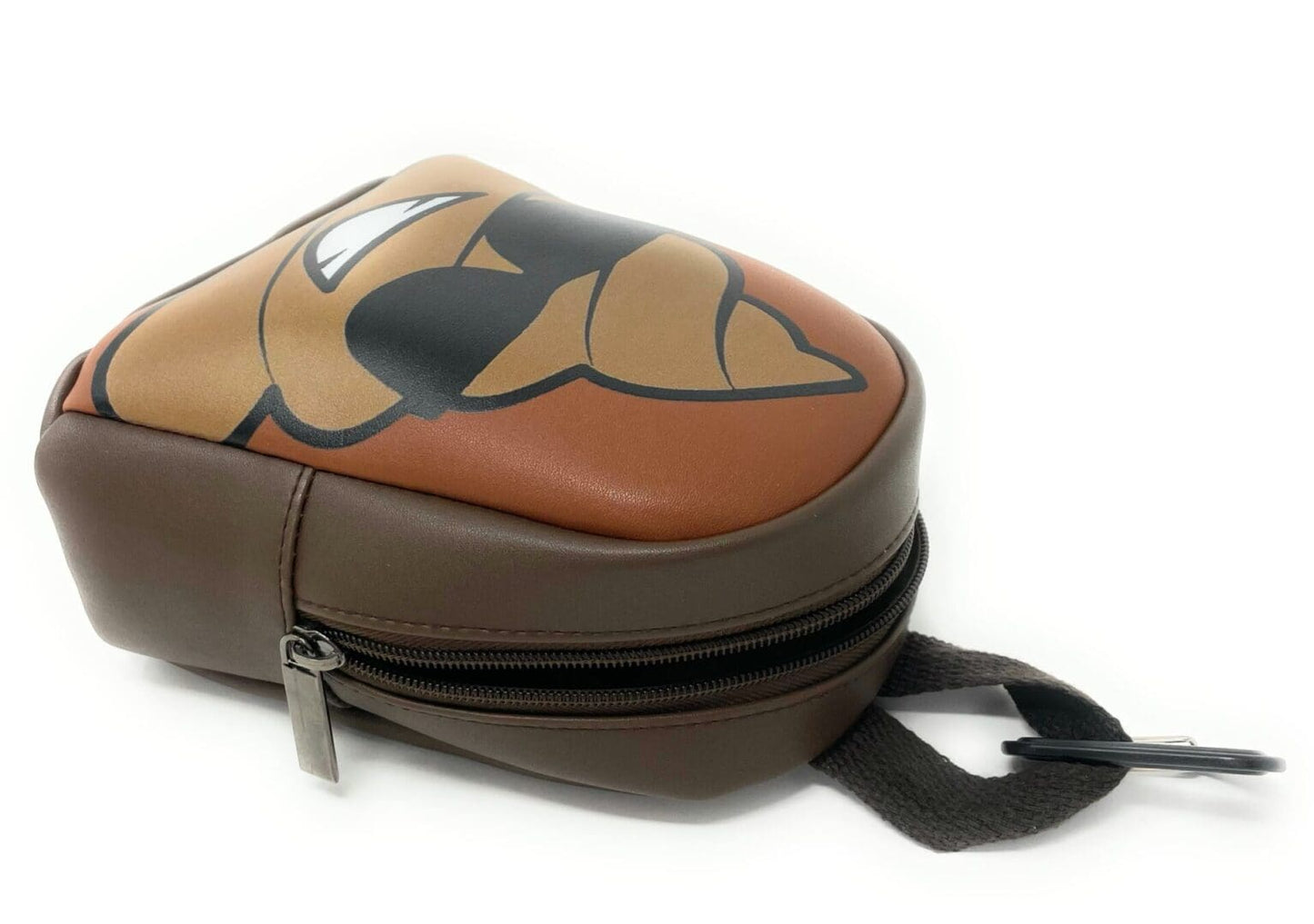 A brown and tan bag with a face on it.