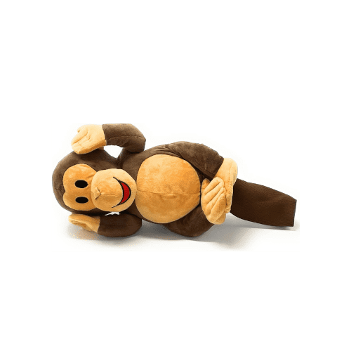 A stuffed monkey laying on its back