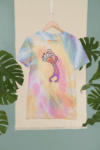 mockup-of-a-custom-tie-die-t-shirt-hanging-in-a-tropical-setting-m4032 (1)